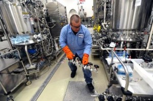 Bob Anderson breaks down fermentation tanks in the Pilot Lab at Amgen in Longmont.